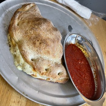 Fellini's Pizza - Calzone is a must, my favorite is sausage, spinach and cheese. - Pizza Near Me - Atlanta, Georgia Fellini's Pizza - Calzone is a must, my favorite is sausage, spinach and cheese. - Pizza Near Me - Atlanta, Georgia