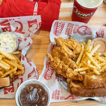 Raising Cane's Chicken Fingers - two baskets of fried chicken and french fries - Fast Food Near Me - Barrack, Hawaii Raising Cane's Chicken Fingers - two baskets of fried chicken and french fries - Fast Food Near Me - Barrack, Hawaii