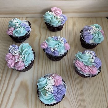 Indie Sweets - six cupcakes on a wooden table - Cupcakes Near Me Indie Sweets - six cupcakes on a wooden table - Cupcakes Near Me