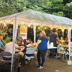 El Sabor Del Mangu - Small party group enjoying the music and food.