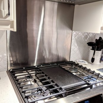 Mike Reed Tile - Metal trim to outline the transitions into a stainless backsplash. Very cool! - Tiling Near Me - Tarzana, California Mike Reed Tile - Metal trim to outline the transitions into a stainless backsplash. Very cool! - Tiling Near Me - Tarzana, California