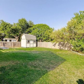 Carl's Lawn Services - the back yard of a home - Lawn Services Near Me