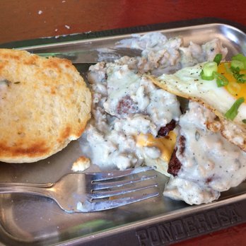 Icehouse - Sausage smothered in gravy on freshly made biscuit topped with fried egg. - Tex-Mex Near Me - Montreal, Quebec