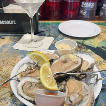 Rockefellers Raw Bar - Raw Oysters on the Half Shell, martini - Seafood Near Me - North Myrtle Beach, South Carolina Rockefellers Raw Bar - Raw Oysters on the Half Shell, martini - Seafood Near Me - North Myrtle Beach, South Carolina