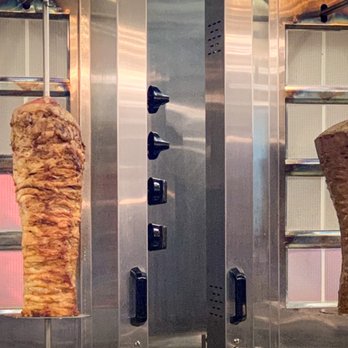 Go Greek - Cooking meat - Greek Near Me - Bohemia, New York