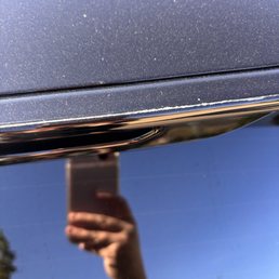 Scratch from the brush on the back of my car above window. Heard the staff slam the brush into my car