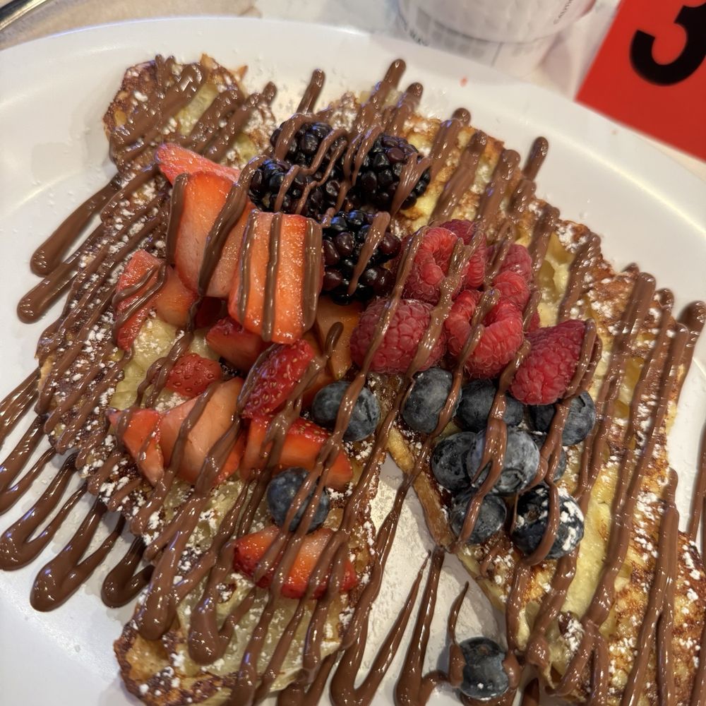 Nutella Cafe - Croissant French Toast with mixed berries and Nutella drizzle - Desserts Near Me - Chicago, Illinois Nutella Cafe - Croissant French Toast with mixed berries and Nutella drizzle - Desserts Near Me - Chicago, Illinois