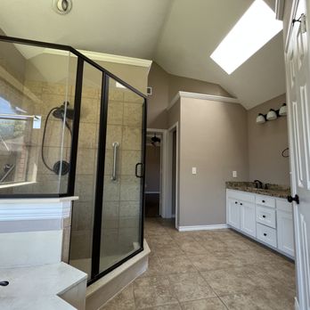 DFW Improved - a large bathroom with a walk in shower - General Contractors Near Me - Plano, Texas DFW Improved - a large bathroom with a walk in shower - General Contractors Near Me - Plano, Texas