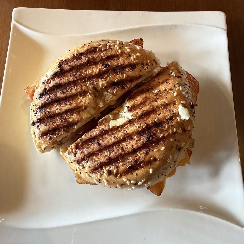 Everything breakfast bagel sandwich with bacon. Everything breakfast bagel sandwich with bacon.