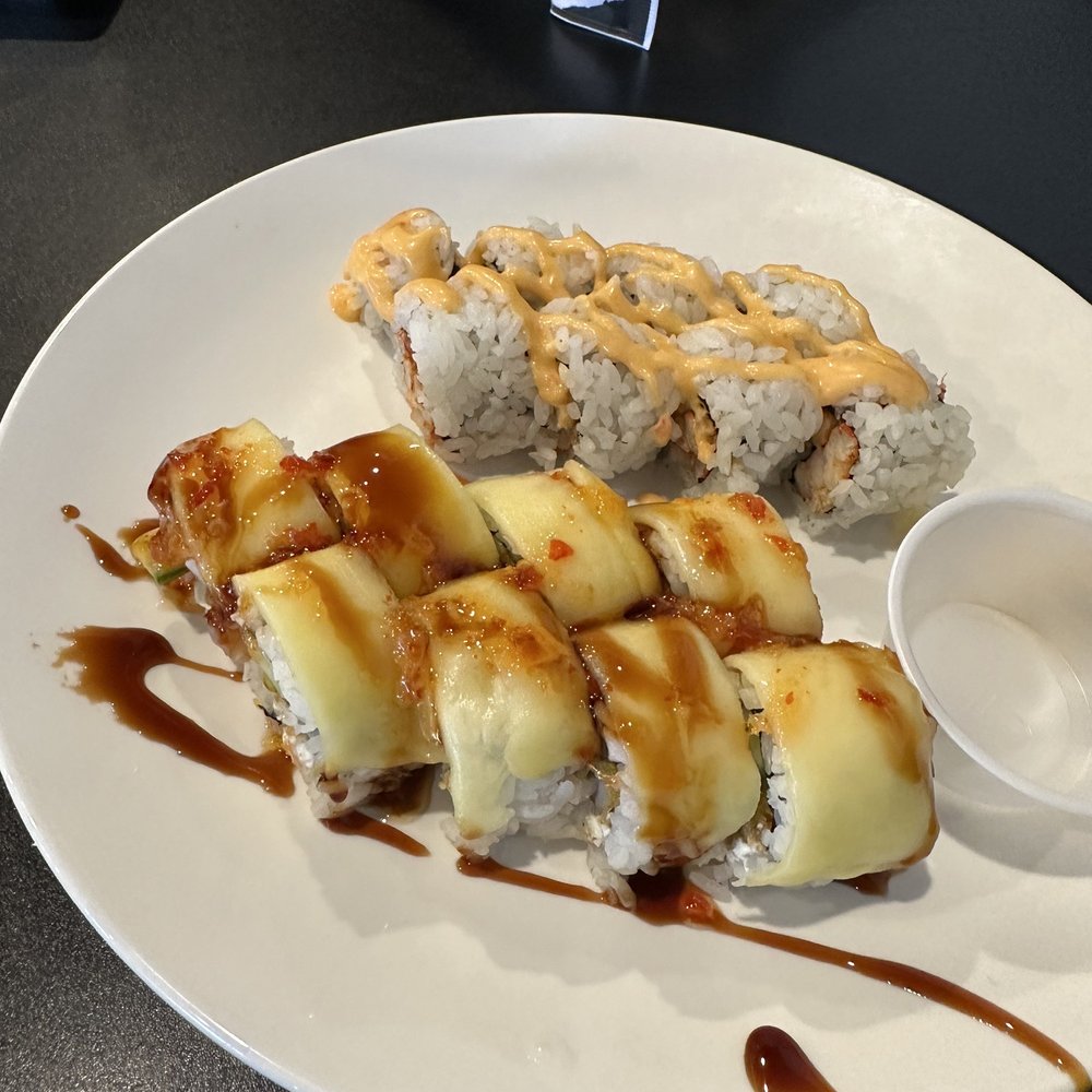 Rock N Roll Sushi - The Experience Roll and in the back is the Spicy Crawfish Roll - Sushi Bars Near Me - Memphis, Tennessee Rock N Roll Sushi - The Experience Roll and in the back is the Spicy Crawfish Roll - Sushi Bars Near Me - Memphis, Tennessee