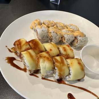 Rock N Roll Sushi - The Experience Roll and in the back is the Spicy Crawfish Roll - Sushi Bars Near Me - Memphis, Tennessee Rock N Roll Sushi - The Experience Roll and in the back is the Spicy Crawfish Roll - Sushi Bars Near Me - Memphis, Tennessee