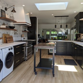 Acha Construction - a kitchen with a washer and dryer - General Contractors Near Me