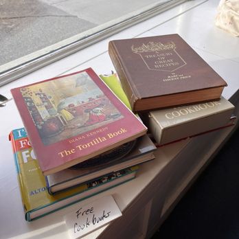 The Placid Baker - a stack of books on a window sill - Bakeries Near Me - Troy, New York