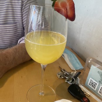 Union Restaurant - That's how they serve mimosas- half a glass with a dry strawberry! - Cocktail Bars Near Me - Portland, Maine