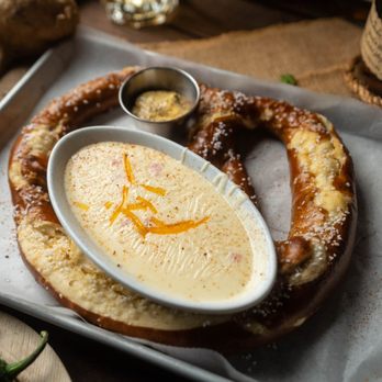 B&B Tavern - a pretzel with cheese dip - New American Near Me - Canton, Georgia B&B Tavern - a pretzel with cheese dip - New American Near Me - Canton, Georgia