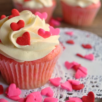 Graca Bakes - a cupcake with white frosting and pink sprinkles - Cupcakes Near Me Graca Bakes - a cupcake with white frosting and pink sprinkles - Cupcakes Near Me