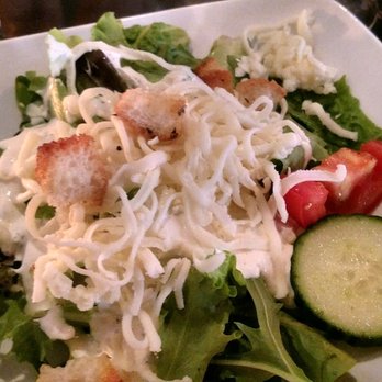 Simon's - Crisp green salad with a yummy creamy parmesan dressing. - Italian Near Me - Des Moines, Iowa Simon's - Crisp green salad with a yummy creamy parmesan dressing. - Italian Near Me - Des Moines, Iowa