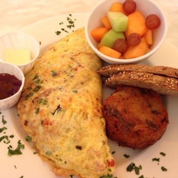 Cafe Monte - The fruit de mer omelette with smoked salmon, crab, lobster, scallions and tomato. - French Near Me - Charlotte, North Carolina