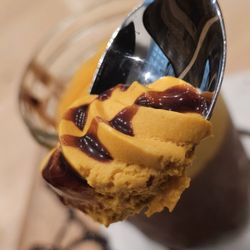 Inka Grill - A spoonful of the Chocolucma dessert with the chocolate syrup all over it.