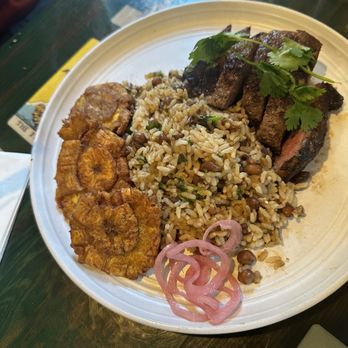Qui Qui DC - Vaca Brava  Sirloin steak seared served with aji criollo, mamposteao de gandules (rice with pigeon peas )con tostones. - Puerto Rican Near Me - Washington, DC, District of Columbia