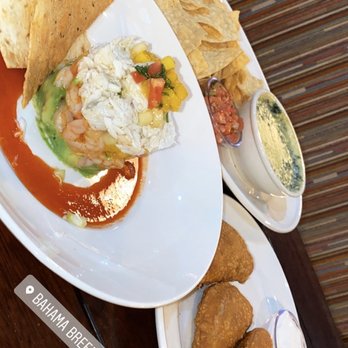 Bahama Breeze - Happy hour! Crab & avocado stack, spinach dip, beef empanadas - Seafood Near Me - Raleigh, North Carolina Bahama Breeze - Happy hour! Crab & avocado stack, spinach dip, beef empanadas - Seafood Near Me - Raleigh, North Carolina