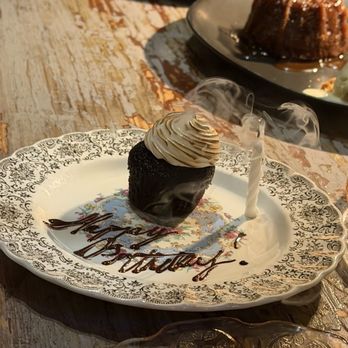 ABC Cocina - Birthday cupcake and candle - Latin American Near Me - New York, New York