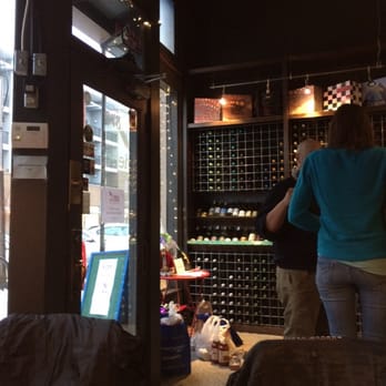 Mass Ave Wine - A glimpse of the wine wall. Tons of unique wines within the $10-$20 range! - Cheese Shops Near Me - Indianapolis, Indiana