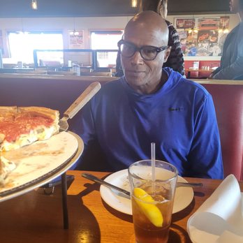 Giordano's - Stan Davis eating the delicious pizza - Salad Near Me - Las Vegas, Nevada
