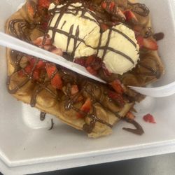 Scoop & Roll Ice Cream Good Eats & Treats - This is the bubble waffle with Ice Cream, Strawberries, and Nutella sauce