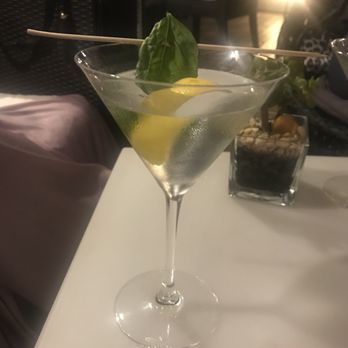 Ambrosia Rooftop Restaurant & Bar - Vodka martini with the unusual garnish of a basil leaf which worked extremely well. - Italian Near Me - Rome, RM Ambrosia Rooftop Restaurant & Bar - Vodka martini with the unusual garnish of a basil leaf which worked extremely well. - Italian Near Me - Rome, RM