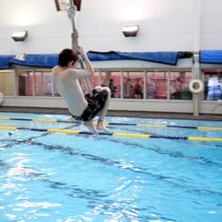 YMCA of Sequim - SARC's Aquatic area has plenty of fun activities for the kids including a rope swing, water slide, diving board and more.