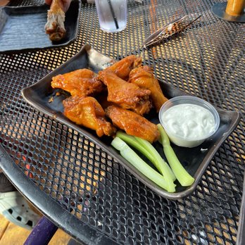 Three Monkeys Cafe - Wings, bleu cheese and celery. - New American Near Me - Philadelphia, Pennsylvania
