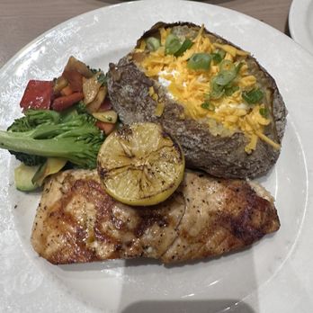 Firebirds Wood Fired Grill - Wood Grilled Salmon* - veggies and loaded baked potato - Steakhouses Near Me - Tucson, Arizona Firebirds Wood Fired Grill - Wood Grilled Salmon* - veggies and loaded baked potato - Steakhouses Near Me - Tucson, Arizona