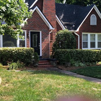 JP Lawn and Landscaping - the front of a brick house - Landscaping Near Me JP Lawn and Landscaping - the front of a brick house - Landscaping Near Me
