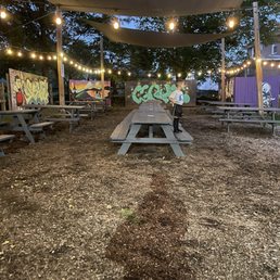 Outdoor tables- covered & loved the graffiti art Outdoor tables- covered & loved the graffiti art