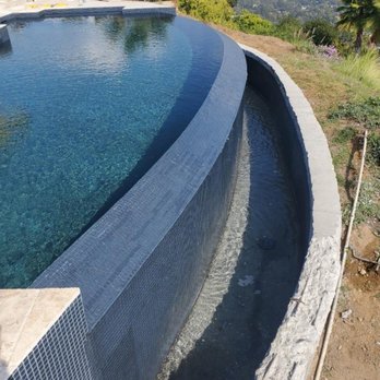 Omega Pool Remodeling - Infinity with black glass tile. - Pool & Hot Tub Service Near Me - Los Angeles, California Omega Pool Remodeling - Infinity with black glass tile. - Pool & Hot Tub Service Near Me - Los Angeles, California