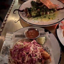 Fish tostada and octopus on skewers