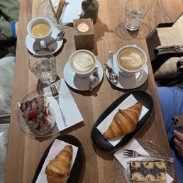 Cappuccino, coffee, croissants , and Budapest cake Cappuccino, coffee, croissants , and Budapest cake
