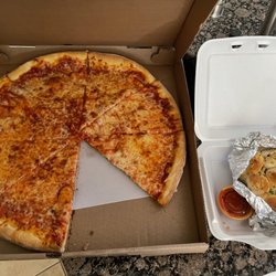 Valentino's Pizzeria - Large cheese pizza $15 and super tiny 1"x1" bite size garlic "knots" $4.