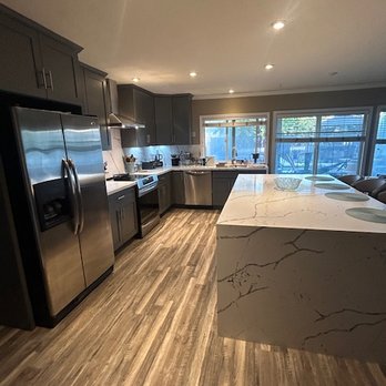 SunFire Construction - He suggested wrap around quartz waterfalls to keep our dogs from chewing the cabinets. - Solar Installation Near Me