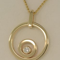 Emil's Jewelry Design - Lives intertwined .. Gold from Mom and Dad's wedding rings, diamond from Grandmother's engagement ring all worn close to the heart.
