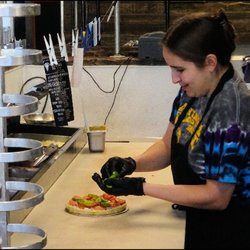 After placing my order of a "Personal Size Pizza," chef Gena began to work on my pizza, to my order, and created it, as I watched.