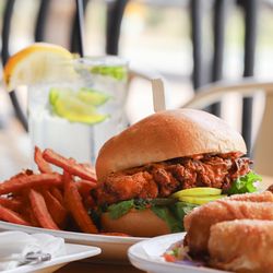 All American Sports Grill - Enjoy our Southern Fried Chicken Sandwich with BEAUTIFUL views of the Fountain from the Patio!