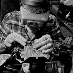 Mainestone Jewelry - Owner and goldsmith Ron Gelinas at his workbench.