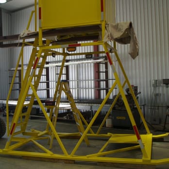 Cactus Welding - a yellow tower in a warehouse - General Contractors Near Me Cactus Welding - a yellow tower in a warehouse - General Contractors Near Me