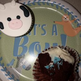 Red velvet cupcake. With cow design, and blue frosting for gender reveal!!! Red velvet cupcake. With cow design, and blue frosting for gender reveal!!!