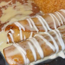 Chicken Chimichangas with cheese, rice and beans.