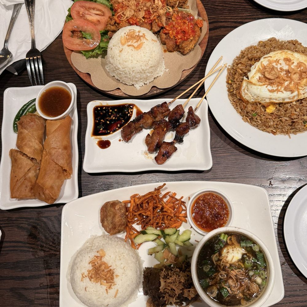 Smashed chicken rice plate, salted fish fried rice, bbq pork sticks, lumpia, beef rice platter with soup. Smashed chicken rice plate, salted fish fried rice, bbq pork sticks, lumpia, beef rice platter with soup.