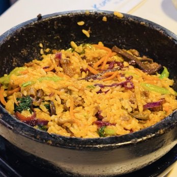 Korea Garden - We let the bibimbap rest in its hot stone bowl to lightly toast - Korean Near Me - Honolulu, Hawaii Korea Garden - We let the bibimbap rest in its hot stone bowl to lightly toast - Korean Near Me - Honolulu, Hawaii