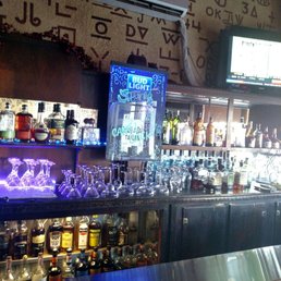 a bar with a variety of liquors a bar with a variety of liquors